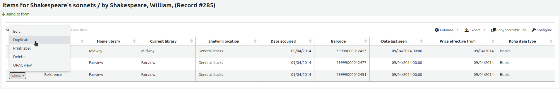 Manage items page, the 'Actions' button next to an item is open and the options are Edit, Duplicate, Print label, Delete, and OPAC view. The mouse cursor is over the Duplicate option.